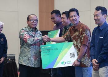 Pj. Gubernur Lampung Luncurkan Jamsostek Untuk 18.612 Pekerja Rentan Melalui DBH Sawit